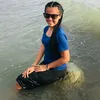 T.