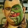 guywitha_snake_onhisface