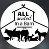 All seated in a barn