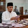K. H UJANG BUSTOMI
