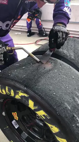 Checking #tire wear after a run. The #rubber we #burn off was picked up by the #hot tire. It wasn’t originally on that tire. #NASCAR