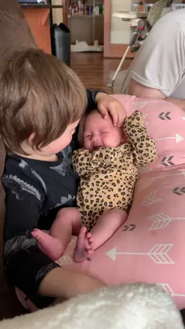 Big brother with his baby sister. Hahaha she farted on her brother while he got to hold her for his first time. #priceless