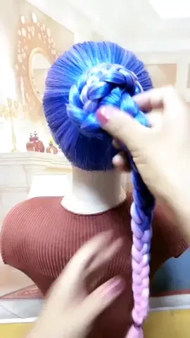 Make a bun with 3 braids. #hairstyles #hairtrainer