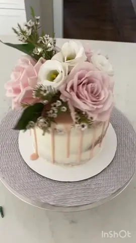 Make your own semi-naked baby shower cake with fresh flowers! #LearnOnTikTok #babyshowercake #floralcake #dripcake
