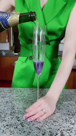 A floral, bubbly, and easy to make NYE cocktail: the Elizabeth Taylor. #makeadrink #champagne #nye #fyp #recipes