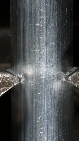 Cutting off an aluminum rod in close-up #macrovideo