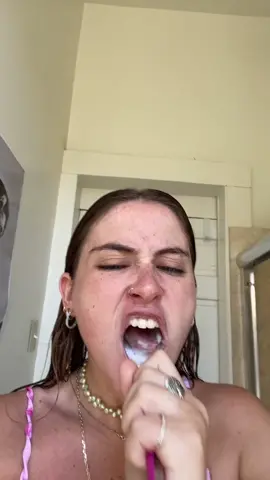 aggressively brushing my teeth