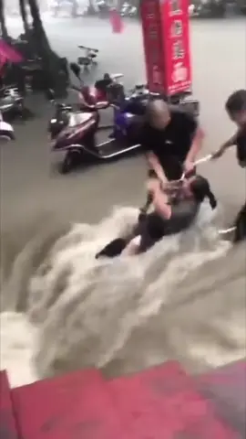 Major floods his China today July 20th, 2021! Woman is rescued from drowning!#subway #china #chinaflood #flood #fyp #news #rescue