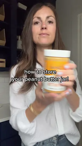 chances are you’ve been storing the jar the wrong way. this how to store natural peanut butter to make the stirring process less annoying when you open a fresh jar! #TipTok #peanutbutter #KitchenHacks #pantryrestock