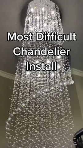 21 foot crystal chandelier 😅#skyscraper #littlegiant #ladder  #chandelier #crystal   #worklife #electriciansoftiktok #electrician #hardwork #talentotiktok #installation #fyp #BlueCollar #electrical #contractorsoftiktok #contractorlife