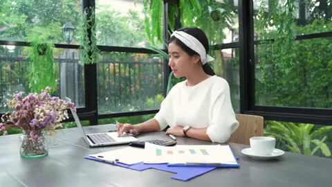 Young Asian woman working on laptop - Free HD Video Clips & Stock Video Footage at Videezy!