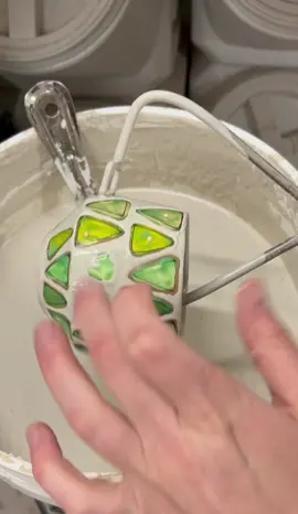 Glazing rainbow mugs. Tapping breaks the surface tension. Magic every time! #pottery #clay #ceramics #handmade
