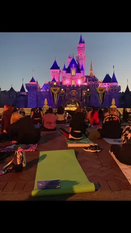 Sunrise yoga infront of Sleeping Beauty's castle at Disneyland #internationalyogaday #disneyland #disneycastlife #disneycastmemberlife #yoga #sleepingbeautycastle #disney #goodvibes