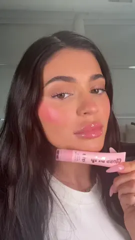 a glowy summer dream ✨ my brand new @kyliecosmetics products “Glow Balm” & “Gloss Drip” coming this July and i’m obsessed 💗