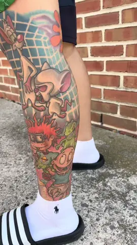 90’s cartoon leg sleeve healed over two years now.  #tomandjerry #barneyandfriends #pinkyandthebrain #rugrats #tommyandchucky #proveniatattoo