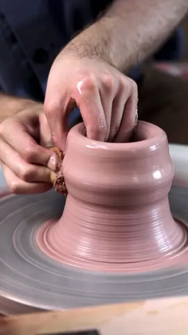 Throwing an angular vase form on the potter’s wheel. Made from about 1 kg of high iron stoneware clay, hence the colour of the clay. #wheelthrowing #pottery #satisfying #artwork #handmade