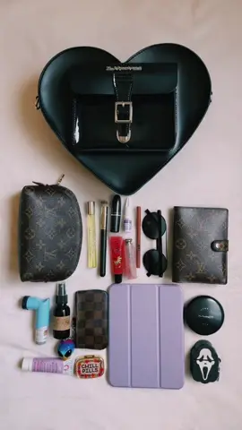 Here’s what I can fit in my doc marten heart bag babes! 🖤 btw that is a mini iPad💜 #FilmTeyvatIslands #BigInkEnergy #AEJeansSoundOn #WorldPrincessWeek #docmartens #docmartenbackpack #alttiktok #altfashion #altgirl #minivlog #whatsinmybag #altgirlfashion #louisvuitton #ipadmini #everydaybag #outfitinspo 
