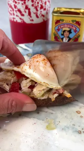 Spicy 🦀Toast!! Serves 4.                       8 oz lump crab meat, 1/2 C chopped cherry tomatoes, 1/4 red onion chopped, 3 scallions sliced, 1 celery stalk minced, 2 tbsp olive oil, 1/2 lemon juiced, 1/4 tsp salt, 1/4 tsp pepper, 1/4 cup mayo, 1 tsp Calabrian jarred chili pepper, 4 Fried eggs, 4 grilled toast