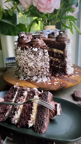 If you love almond joy Mounds then you must try this 4 layer chocolate coconut cake. Its devilishly good!  You need: @bettycrocker chocolate cake mix and chocolate frosting. Shredded coconut and condensed milk. And of course @almondjoymounds  #chocolatecake #boxedmix #coconutcake #moundscake #viral #momhack #homebaking #baking #soothingvideos #foodvideos #tiktokvideos #bostonbaking #massachusetts #dessert #momcooking #MomsofTikTok 
