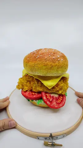 Would you like to take a bite😆? #embroidery #burger #fastfood #3dembroidery #handembroidery #punchneedle #needlework #artwork #art #funart #chickenburger #modernembroidery #artreel 