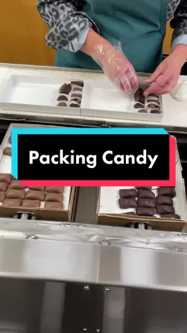 Our packers work hard to keep our cold room stocked! They pack our chocolates into boxes on a moving belt that rotates the candy allowing them to stand in one area. #candy #chocolate #SmallBusiness #ohio 