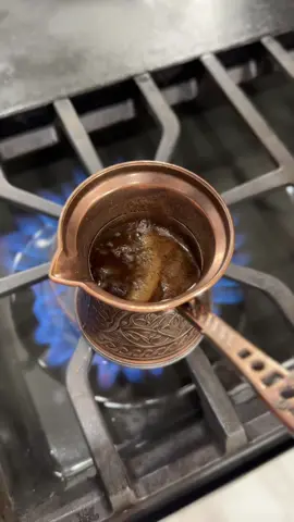 How to make a Turkish coffee. A friend of ours recently travelled to Turkey to visit a relative. He brought back a generous and thoughtful gift for me. Coffee! Turkish coffee to be precise. How sweet was that? You know the expression “When in Rome”? Well I couldn’t just make a Turkish coffee in a regular pot. In this case, I needed to do as the Turkish do. 😃 Liz was thrilled to know I was ordering another coffee device! 🤣😜 Yes, I’m a little addicted.  A Turkish coffee pot is called a Ibrik or cezve. Thanks to Etsy, I was able to order a traditional copper pot straight from Istanbul, Turkey. It looks so cool! For this coffee I used the amount of water for the size of coffee I wanted to drink. I used 100ml of room temp water. I poured the water first and then added 2 tsp of ground Turkish coffee. If you like sugar in your coffee, add it now. I didn’t use any. I mixed the water and coffee before heating it. Based on my research there’s lots of debate for the step. Some folks prefer to stir while it’s heating. Hopefully I’m not offending any traditionalists. I heated the coffee between medium low and medium heat. I let the coffee start to slowly bubble. I removed some of the top foam and added it to my cup. As soon as the coffee started to foam and rise again, I turned off the heat.  I poured the coffee very slowly into the cup in order to try to preserve some of the crema. I let the coffee sit for a couple of minutes before drinking it. So good! Have I mentioned how much I love coffee and coffee culture?!?!  #turkish #turkishcoffee #istanbul #coffee #CoffeeCulture