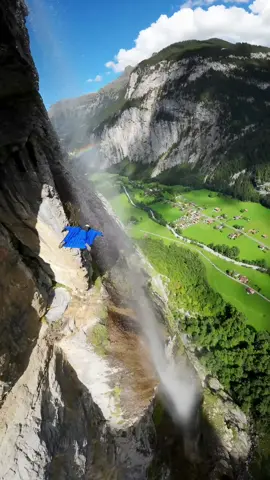 flying my wingsuit through a swiss waterfall 💦 #chasingwaterfalls #wingsuit #basejump #switzerland #fallingwithstyle