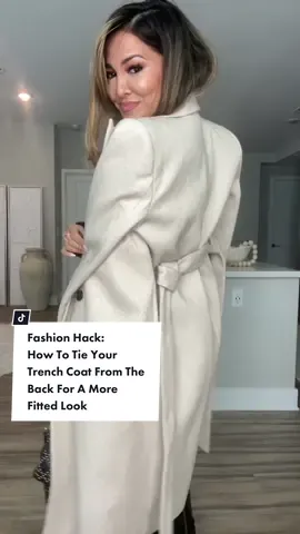Fashion Hack: How To Tie Your Trench Coat From The Back For A More Fitted Look ✨ #fashionhacks   Today’s Affirmation:  “I love everything that has made me who I am” 💫  Here’s a step-by-step on how to create two clean and stylish square knots on the back of your trench or waisted winter coat!  This is perfect for a more fitted look, because it helps accentuates the waist part of the coat without having to tie a big bow in front.  It’s also my go-to anytime I’m styling my coats over my shoulders as well.  Once you try this hack, you’ll never tie your knots the old way again 💫  This hack works on any length waist wraps, as long as you can wrap it around your hand at least once 🙌  TAG someone who would love this 🤍 #fashionhack #OOTD  #grwm #styletipsforyou #beautytips #styletok #outfitideas #fashiontiktok #styletips #fashioninspo #fyp #foryourpage #fashion #foryou 