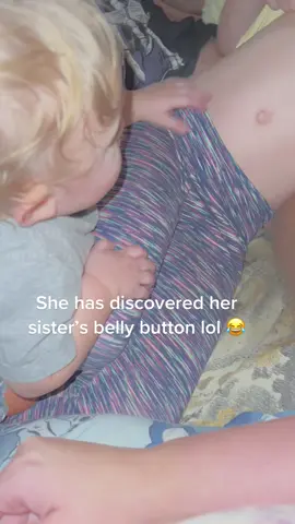 She was very curious of her big sister’s belly button lol 😂 