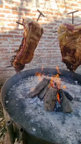 Asado a la cruz 📍 Argentina 🇦🇷  ⭐️ 4.9 💯 #1 best rated meat dish in the world   Asado is the technique and the social event of having or attending a barbecue in Argentina, Chile, Uruguay, Paraguay and in a number of other South American countries. Asado traditionally features a wide selection of grilled meats, mainly beef, which Argentina is most known for. Asado a la Cruz (grilled cross) is a method for roasting ribs of veal, lamp, pork, or whole baby goats, attaching it to a cross-shaped support and roasting them over a fire for between 6 and 7 hours.   📽: IG@riki_rodgriguez13   #traditionalfood #golocal #asado #eatlikealocal #argentinianfood #barbecue #asadoalacruz