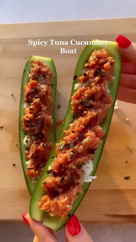 Craving sushi? Try making these spicy tuna cucumber boats! #EasyRecipes #healthyrecipe #cucumberboat #snacks 