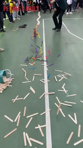 Elementary school students created a colorful 30-plus-meter popsicle stick bomb in Hangzhou, E China's Zhejiang. #China #chinatiktok 