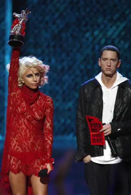 Lady Gaga accepts her award from Eminem onstage during the 2009 VMAs #ladygaga #popculture #2000s 