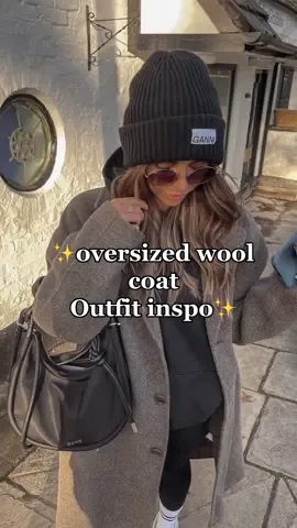 IG - beth_bartram | casual everyday outfits I wear as a 38 year old mum  of three: oversized wool coat , black oversized hoodie , yoga pants , sports socks , Ugg Tasman , Ganni knit bag and Ganni beanie #outfitideas #casualoutfits #over30sclub 