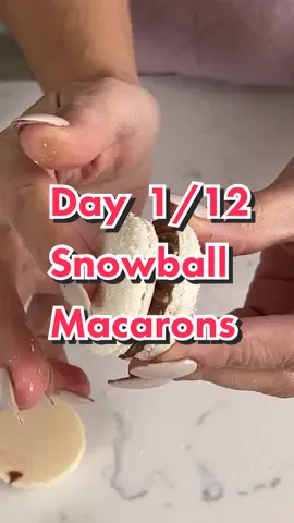 It’s day 1 of the 12 days of Macarons! Today we are making snowball macarons based on the traditional Hostess Snowball cakes using my Italian macaron recipe! It’s a coconut macaron shell with marshmallow buttercream and chocolate ganache for the filling 😛 It’s topped it with Wafer paper and luster dust to create the snowball design! #macaron #macarons #italianmacarons #christmasbaking #christmasdessert #snow #12daysofchristmas #12daysofmacarons #