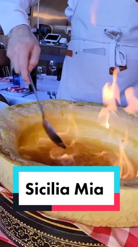 Get the Carbonara! This is an Italian pasta dish from Rome, carbonara is made with egg yolk, aged Parmesan, cured pork, and black pepper. They do it table side in a flaming 🔥wheel of cheese and tossing right in front of you! It is such an amazing experience!  #italianfood #pasta #carbonara 