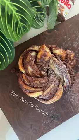 Easy Nutella wreath 🎄✨ Bake at 350°F for 30 minutes, cover with foil and bake for an additional 20 minutes #cookingtiktok #holidayrecipe #recipesoftiktok #christmas #christmasrecipe #desserttiktok 
