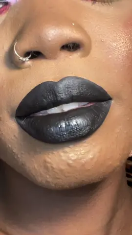Whenever I do a rainbow look I find that instead of stressing over what lip to do with it… just wear black. This is the Dudu liquid lipstick from @juviasplace #makeup #mua #makeupartist #lipstick #liquidlipstick #liptutorial #blacklipstick #melanin #lips #matte #foryou #blackgirltiktok 