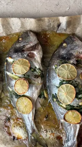 Baked Sea Bream 🐟 All you need is garlic, butter, parsley, rosemary, salt and pepper + lime on top #ovenbaked #fish #seabream #receptai #žuvis #Recipe #homechef