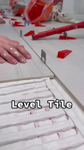 Using @guru.usa.llc leveling clips to set this tile floor. #bathroomrenovation #construction #DIY #tools ##realestate##tileinstallation##tutorial##homeimprovement
