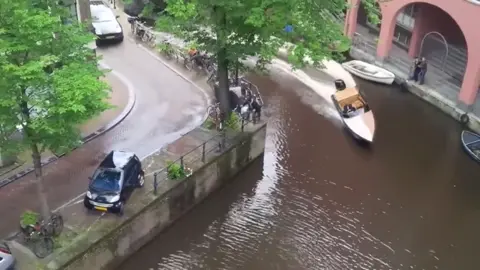 Big #porsche fail, ended up not such a smart car now!! 😂😂 #porsche #flood #flooddamage #help #fyp #viral #dangerous #follow #amserdam #sharethecare #follow #whatsnext #ripcar #boat #smartcar #carsoftiktok #car 