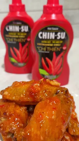 Gearing up for the Super Bowl with some lovely “Sweet Chili Wings”  Recipe & Instructions (15 wings)  Step 1: Pat chicken wings completely dry & marinade with: - 2 tsp onion powder  - 2 tsp granulated garlic powder  - 1 tsp salt  - 1/4 cup of potato starch and corn starch  - 1 tbsp of oil  - Set aside  Step 2: Air Fry Chicken - Set chicken into the air fryer at 375 degrees (flip once on each side for a total cook time of 20mins) - After the first round of air frying, adjust temperature to 400 degrees and airfry for another 10-15mins  Step 3: Sweet Chili Sauce - Combine 1.5 cups of sugar, 1/2 cup of vinegar, 1/2 cup of water, 1/4 cup of garlic, 1/4 cup of minced red bell peppers, Bird’s eye chili (optional), dash of fish sauce - Simmer on medium high heat for 15 mins - Mix 2 tsp of cornstarch with 2 tbsp of water and add into the sauce  - Simmer on low for 2-5 mins, adjust desired thickness with more cornstarch slurry or water  - Add Chin-Su hot sauce and mix well  - Allow sauce to cool, then incorporate wings into the sauce  #Ad #Sponsored #Foodie #Recipe #chinsu #chinsuhotsauce #chinsupartner #recipes #contentcreator #foodblogger #chickenwings #seattlefoodie #appetizers #SuperBowl #superbowlrecipes #recipeideas 