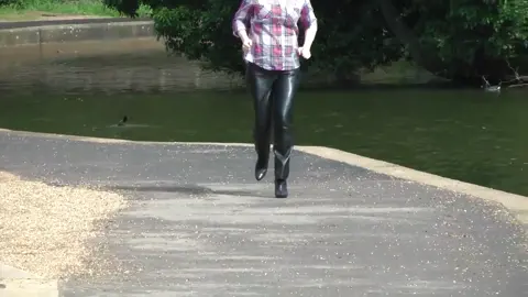 blonde girl running funny leather pants#leather