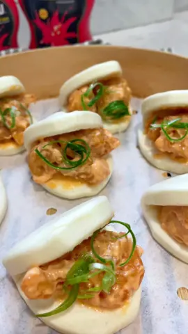 SUPER EASY Dynamite Shrimp & Lobster Bao Buns  == Recipe & Instructions (12) Bao Buns  Step 1: Prep Lobster & Shrimp  - De-shell (2) lobster stairs   - Peel & devein 1/2 Ib of shrimp   - Chop & set aside  Step 2: Batter mix  - Set the following into (2) separate bowls - 1 cup of tempura flour  - 1/4 cup of water  - 2 tsp of chicken powder  - 1 tsp of garlic powder - Mix well & incorporate seafood into the blend  Step 3: Dynamite sauce    Blend & incorporate the following into a bowl:  - 1/4 cup of mayonnaise   - 2 tsp of chili powder   - 1 tsp of garlic powder  - Chin-Su hot sauce as desired  - Set aside  Step 4: Deep fry   - Bring oil to a pot/pan & set to high heat - Fry lobster until golden & set aside   - Fry shrimp until golden & set aside Step 5: Bao Buns   - Bring water to a boil into a pot/pan - Set bao buns onto a steamer & transfer over the boiling pot of water (covered)  - Steam for 2-3 mins  Step 6: Assemble    - Incorporate fried lobster & shrimp into dynamite sauce  - Add to steamed buns - Garnish with green onions Serve and enjoy!   #chinsu #chinsupartner @_chinsuhotsauce_ 