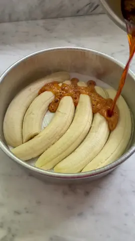 Never not thinking about her!!!!! Banana bread should always be upside down and covered in caramel!!!! Upside Down Banana Bread For the Topping: Nonstick cooking spray, for greasing 3 just-ripe, firm bananas, sliced lengthwise  3/4 cup granulated sugar 2 tablespoons water For the Batter: 1 cup light brown sugar 3 very-ripe bananas, mashed 3/4 cup extra-virgin olive oil 1/2 cup low-fat plain Greek yogurt or sour cream 2 teaspoons vanilla extract  2 large eggs, at room temperature 2 cups all purpose flour 1 teaspoon kosher salt 1/2 teaspoon baking soda 1/2 teaspoon baking powder 1/2 teaspoon ground cinnamon 1/2 teaspoon ground nutmeg 1 cup dark chocolate chips or chopped dark chocolate  1. Prepare the topping: Preheat the oven to 350˚F. Grease a 9-inch round cake pan with nonstick spray and line with parchment. Place the bananas cut side down on the parchment, arranging or trimming to fit. In a medium saucepan, combine the sugar and water over medium-high heat. Cook, shaking the pan if needed, until an amber caramel forms, about 6 minutes. Immediately pour over the bananas in an even layer. 2. Prepare the batter: In a large bowl, whisk the brown sugar and mashed bananas until a relatively smooth paste forms. Whisk in the olive oil, yogurt, vanilla, and eggs until well incorporated. 3. Add the flour, salt, baking soda, baking powder, cinnamon, and nutmeg. Stir until just incorporated and there are no pockets of flour, then fold in the dark chocolate chips.  4. Pour the batter over the caramel-coated bananas and smooth with a rubber spatula. Bake for 55 to 60 minutes, until golden and cracked with an internal temp of 190°F.  5. Let cool 15 minutes, then run a paring knife along the edges of the cake. Place a plate over the cake pan and invert, discarding parchment paper. Let cool slightly, then serve warm. ##banana##bananabread##baking#caramel 