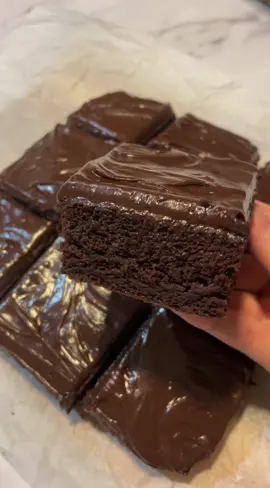 Super moist chocolate cake 🍫 full recipe 👇 Ingredients: 130g all purpose flour  200g sugar  65g cocoa powder  3/4 tsp baking powder  1/2 tsp baking soda  1 egg 60ml oil 130ml milk 120ml warm water  1 1/2 tsp instant coffee  1 tsp vanilla extract  Toppings: 450g chocolate  280ml heavy cream  Method: 1) mix together all of the dry ingredients in a large mixing bowl. 2) into the fry ingredients add all of the wet ingredients and mix together well. 3) pour into a lined 8x8 inch baking tray. 4) bake in preheated oven for around 30 minutes on temp 150 degrees Celsius. 5) once cooked transfer to a wire rack and allow the cake to cook completely.  6) make your topping by cutting the chocolate into small pieces. Gently warm your cream and pour over the chocolate. The cream should melt the chocolate. Mix well. If not fully melted pop in microwave for a few seconds at a time until fully melted. Be careful not to over heat.  7) spread your topping all over the cake. 8) serve and enjoy 😊 #chocolatecake #moistcake #chocolate #chocolatelover #cakerecipe #easycakerecipe #deliciouscakes #Foodie #sweettooth #fyp 