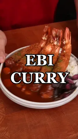 Jumbo Japanese Shrimp Curry (Ebi Furai Curry) 🍤🍛 #ebifurai #katsucurry #shrimpcurry #japanesecurry #curry #japanesefood #カツカレー #エビフライ #Japanesefood #asmrcooking #asmr Ingredients used: Ebi furai: - Tiger prawns - Flour - Panko - Egg Curry: - 4 tbsp butter - Onions, diced - 2 tbsp Tomato paste - 1 Apple, chopped - 1 Carrot, chopped - 7 marble potatoes, chopped - 6 cups Chicken Stock - 1 pack Japanese curry cubes - 3 tbsp Tonkatsu sauce - 2 tbsp honey - 1 tsp cocoa powder Garnish: - Aonori powder - Japanese pickles 𝗜𝗻𝘀𝘁𝗿𝘂𝗰𝘁𝗶𝗼𝗻𝘀: - In a pot, saute onions in butter until csramelized, add in tomato paste and let cook for about 1 min. Add in chopped apples and chicken stock. - Add in your curry cubes and simmer until thickened. Blend until smooth.  - Season with Tonkatsu sauce, honey and cocoa powder (this adds more body and richness to the curry) - Add in your potatoes and carrots and simmer until fork tender. - Peel and devein tiger prawns. Make tiny cuts along belly of the shrimp making sure not to go all the way through. Dredge in flour, egg and panko. Deep fry at 165C until crisoy and golden. - Serve Ebi Furai on top of rice, drizzle over curry sauce, top with aonori powder, place japanese pickles on the side and enjoy! ❤️