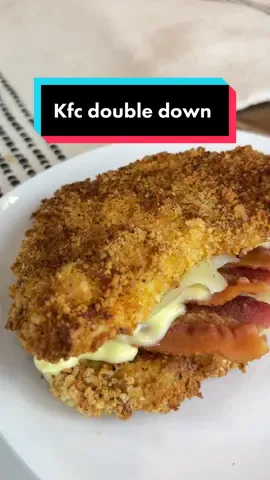 Say “YES” if you would eat this Copycat KFC DOUBLE DOWN 🤤 Ingredients: 2 chicken breasts, beaten flat Egg, whisked Crushed pork rinds, blended is best 2 slices of cheese, Swiss or provolone  Bacon Seasonings of your choice  Instructions:  1. Whisk an egg in one bowl and mix your pork rinds & seasonings in another. 2. Coat your chicken in the egg wash and the. pork rind mix.  3. Air fry @ 400F for 10-15 mins (until internal temp reaches 165F)  4. Take out, add your cheese & bacon. Sandwich together & enjoy!  This isn’t something I would eat all the time but it was delicious as heck 🙌