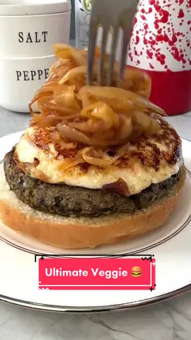 SHARE my VEGGIE BURGER WITH SWEET & SMOKEY CARAMELIZED ONIONS & FRIED QUESO FRESCO with someone who is looking for delicious meatless lunch and dinner options! Makes 3 to 4 Burgers Veggie Burger 2 eggplant diced or 2 cans of drained black beans 1 tsp chipotle chili powder  1/2 tsp cumin 1/2 tsp oregano 1/2 tsp salt 1/2 tsp onion powder 2 garlic cloves peeled 1/4 C cilantro  1/2 C panko 1/2 C cooked quinoa 1 egg 1.5 tbsp olive oil 3 brioche buns 3 slices of queso fresco about a 1/2 inch thick Sweet and Smokey Onions 1 tbsp butter 2 onions sliced thin 1/4 tsp salt 1 tbsp of juice from canned chipotle in adobo 1.5 tbsp maple syrup -Preheat oven to 450F. -Add diced eggplant to colander, salt generously and let sit for at least 15 minutes.  -Place eggplant onto parchment lined baking sheets. Use a paper towel to wipe off the moisture and pat eggplant dry.  -Lightly drizzle eggplant with olive oil & roast for 20 minutes, flip and roast for an additional 20 minutes.  -Add the first 11 ingredients to a food processor and pulse until the ingredients are well combined. Form into burger patties. -Add 1/2 tbsp olive oil to a non-stick skillet and heat over medium-high. Once hot, add the veggie burger and cook for about 2 minutes on each side.  -Wipe pan and add remaining olive oil. Heat olive oil over medium-high. Once the pan is hot, add queso fresco. Cook for about 1 minute on each side.  -Top burgers with caramelized onions (recipe below) and fried queso fresco! Sweet & Smokey Caramelized Onions -Add butter to a medium-sized skillet. Melt butter over medium heat. Once the butter has melted, add sliced onions and salt. Cook low and slow until the onions are silky and caramelized. Add maple syrup and chipotle in adobo, cook for 1 more minutes and remove from heat. #vegetarian #veggieburger #blackbeanburger #vegetarianrecipe #fyp #yum #FoodTok #Recipe 