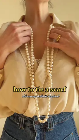 Do you have a long pearl string that you have no idea how to style? Here is my suggestion with the help of a long scarf 🤍  Save this for future inspo! #oldmoney #oldmoneyaesthetic #oldmoneyoutfits #howto #scarftutorial #outfitideas #elevateyourstyle #frenchstyle #parisianstyle #fypシ #pearlnecklace 